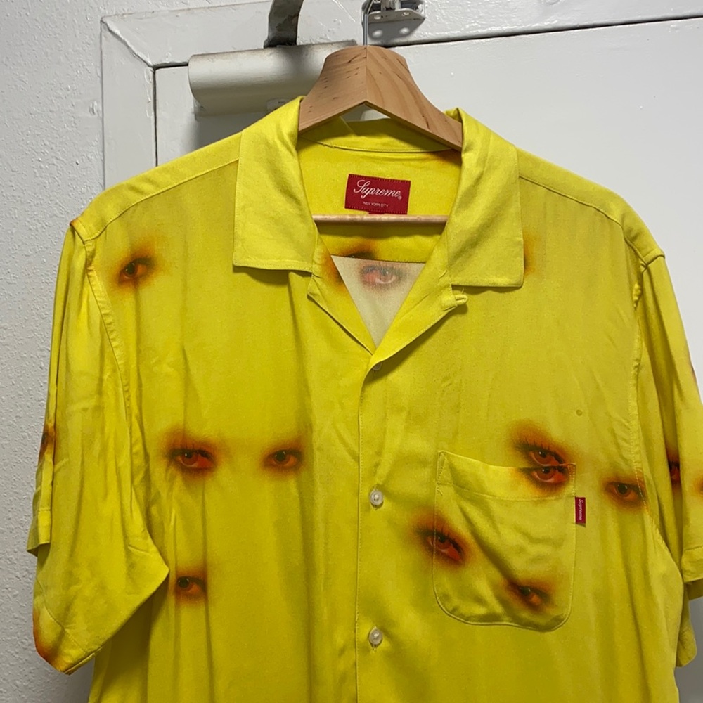 Supreme “eyes” button up.